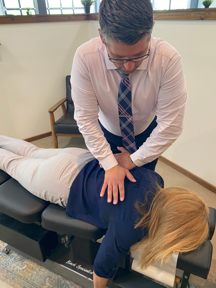 chiropractor making an adjustment